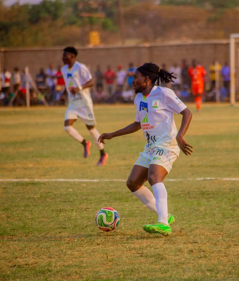 On the ball: A Masters FC player in possession during a match.